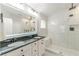 Beautiful primary bathroom with a dual sink vanity, luxurious walk-in shower, and marble tiling at 4228 Laurel Creek Se Ct # 6, Smyrna, GA 30080