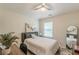 Cozy bedroom featuring a desk area, an accent mirror, and a comfortable bed at 4228 Laurel Creek Se Ct # 6, Smyrna, GA 30080