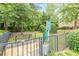 Community dog park with bench seating, waste station, and secure fencing for residents' furry friends to enjoy at 4228 Laurel Creek Se Ct # 6, Smyrna, GA 30080