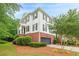 Charming two-story home features a brick foundation, white siding, and a well-manicured lawn at 4228 Laurel Creek Se Ct # 6, Smyrna, GA 30080