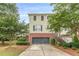 Attractive townhome featuring a 2-car garage, brick facade and well-maintained green spaces at 4228 Laurel Creek Se Ct # 6, Smyrna, GA 30080