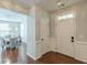 Welcoming foyer with hardwood floors, wainscoting, and a view into the elegant dining room at 4228 Laurel Creek Se Ct # 6, Smyrna, GA 30080