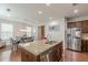 Bright, open kitchen featuring granite countertops, stainless appliances, and an island at 4228 Laurel Creek Se Ct # 6, Smyrna, GA 30080