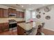Well-equipped kitchen with granite counters, stainless steel appliances and bar stool seating at 4228 Laurel Creek Se Ct # 6, Smyrna, GA 30080