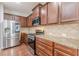 Well-appointed kitchen showcasing stainless appliances, granite counters, and hardwood floors at 4228 Laurel Creek Se Ct # 6, Smyrna, GA 30080