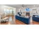 Bright living room features hardwood floors, a fireplace, a ceiling fan, and a nearby bar area at 4228 Laurel Creek Se Ct # 6, Smyrna, GA 30080
