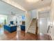 Open living area with hardwood floors, fireplace, and elegant decor with staircase at 4228 Laurel Creek Se Ct # 6, Smyrna, GA 30080