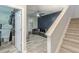 Open concept living room and staircase with wood style flooring and a custom feature wall at 4228 Laurel Creek Se Ct # 6, Smyrna, GA 30080
