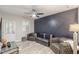 Modern living room with stylish accent wall, plank floors, and seating at 4228 Laurel Creek Se Ct # 6, Smyrna, GA 30080