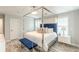 The main bedroom features a canopy bed, a ceiling fan, carpet and lots of natural lighting at 4228 Laurel Creek Se Ct # 6, Smyrna, GA 30080
