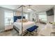 The luxurious main bedroom includes modern decor, a canopy bed, a ceiling fan and lots of lighting at 4228 Laurel Creek Se Ct # 6, Smyrna, GA 30080