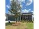 A home with stone and siding with an attached garage and manicured lawn at 710 Pineberry Ct, Grayson, GA 30017