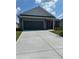 Spacious two-car garage and concrete driveway at 710 Pineberry Ct, Grayson, GA 30017