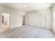 A spacious bedroom with neutral carpet and an open bathroom at 723 Crest Line Trl, Powder Springs, GA 30127