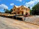 New construction of a two-story home with visible framework and machinery at 723 Crest Line Trl, Powder Springs, GA 30127