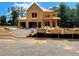 Exterior view of a new construction home, showcasing the framing stage of development at 723 Crest Line Trl, Powder Springs, GA 30127