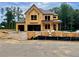 Exterior view of home under construction showing the framing and some roof work at 723 Crest Line Trl, Powder Springs, GA 30127