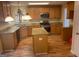 Kitchen with island, granite countertops, stainless steel appliances, and wooden cabinets at 7981 Gossamer Dr, Fairburn, GA 30213
