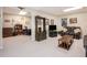 Spacious finished basement features neutral carpet, a seating area, and a bonus room at 1625 Rushing River Way, Suwanee, GA 30024