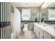 Updated bathroom with a shower-tub combo and ample counter space at 1625 Rushing River Way, Suwanee, GA 30024