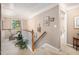 Upstairs hallway featuring carpet floors, light-colored walls, white railing, and trim at 1625 Rushing River Way, Suwanee, GA 30024