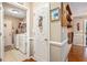 Bright laundry room features tiled flooring, modern washer and dryer, and a utility sink at 1625 Rushing River Way, Suwanee, GA 30024