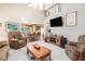 Spacious living room showcasing an open floor plan and seamless access to the dining area and kitchen at 1625 Rushing River Way, Suwanee, GA 30024