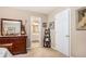 Main bedroom with access to a bathroom through an open door and a view to second bathroom at 1625 Rushing River Way, Suwanee, GA 30024