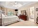 Spacious main bedroom with a ceiling fan, walk-in closet, and ensuite bathroom at 1625 Rushing River Way, Suwanee, GA 30024