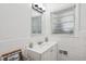Clean bathroom featuring a single vanity, tiled walls, and modern fixtures at 2858 Valley Ridge Dr, Decatur, GA 30032
