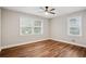 Bedroom featuring wood floors, dual windows and modern ceiling fan at 2858 Valley Ridge Dr, Decatur, GA 30032