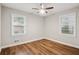 Bright bedroom with wood floors, modern ceiling fan, and dual windows at 2858 Valley Ridge Dr, Decatur, GA 30032