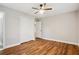 Bright bedroom featuring wood floors, a ceiling fan, and a closet at 2858 Valley Ridge Dr, Decatur, GA 30032