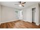 Bedroom features wood floors, ceiling fan, closet, and neutral color palette at 2858 Valley Ridge Dr, Decatur, GA 30032