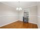 Formal dining room boasting hardwood floors, a chandelier, and natural light at 2858 Valley Ridge Dr, Decatur, GA 30032