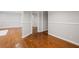 Hallway featuring rich hardwood floors and a neutral color palette throughout at 2858 Valley Ridge Dr, Decatur, GA 30032