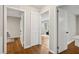 Hallway features wood flooring and access to several rooms with white doors at 2858 Valley Ridge Dr, Decatur, GA 30032