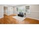 Living room featuring hardwood floors, a large window, and modern decor accents at 2858 Valley Ridge Dr, Decatur, GA 30032