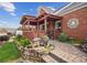 Beautiful backyard with a covered patio, manicured landscaping, and a stone pathway, creating a serene outdoor space at 333 Lauren Ln, Woodstock, GA 30188