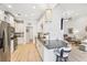 Open-concept kitchen flowing into the living area with a breakfast bar and pendant lighting at 333 Lauren Ln, Woodstock, GA 30188