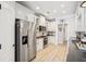 Spacious kitchen featuring stainless steel appliances and white cabinetry at 333 Lauren Ln, Woodstock, GA 30188
