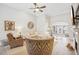 Open living area with a fireplace, high ceilings and large windows providing ample natural light at 333 Lauren Ln, Woodstock, GA 30188