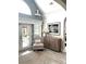 Welcoming living room featuring vaulted ceilings, neutral décor, large windows, and access to the outdoor space at 333 Lauren Ln, Woodstock, GA 30188