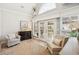 Bright living room featuring vaulted ceilings, neutral décor, large windows, and access to the outdoor space at 333 Lauren Ln, Woodstock, GA 30188
