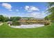 Beautiful view of a serene pond reflecting nearby residences and lush greenery, creating a peaceful ambiance at 333 Lauren Ln, Woodstock, GA 30188