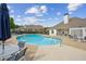 Sparkling community pool with ample seating, umbrellas, and a clubhouse, ideal for summer relaxation and socializing at 333 Lauren Ln, Woodstock, GA 30188
