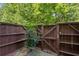 Fenced-in backyard with a view of mature trees at 4960 Meadow Ln, Marietta, GA 30068