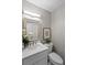 Modern powder room with white vanity, updated fixtures, and stylish decor at 4960 Meadow Ln, Marietta, GA 30068