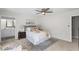 Comfortable bedroom with a ceiling fan and stylish decor and view to the bathroom at 4960 Meadow Ln, Marietta, GA 30068