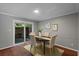 Dining area with sliding glass door to outdoor space and seating for four at 4960 Meadow Ln, Marietta, GA 30068